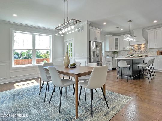 Dining room, Interior, Kitchen, Pendant Lights, Recessed Lighting, Stainless Steel Appliances, Wood Texture Flooring