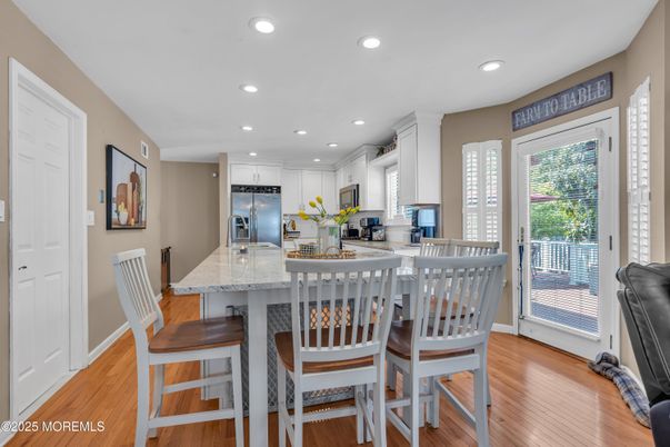 Dining room, Interior, Kitchen, Recessed Lighting, Stainless Steel Appliances, Wood Texture Flooring