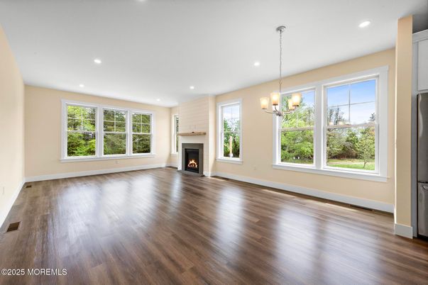 Chandelier, Empty room, Fireplace, Interior, Recessed Lighting, Wood Texture Flooring