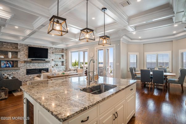 Dining room, Fireplace, Interior, Kitchen, Living room, Pendant Lights, Recessed Lighting, Stone Walls, Wood Texture Flooring
