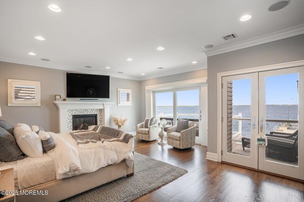 Bedroom, Fireplace, Interior, Recessed Lighting, Water, Wood Texture Flooring