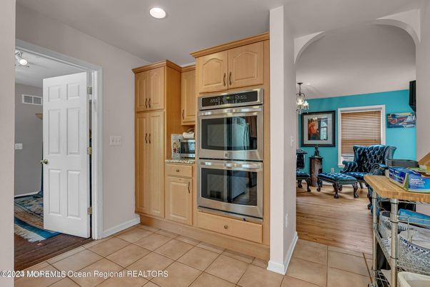 Chandelier, Dining room, Interior, Kitchen, Recessed Lighting, Stainless Steel Appliances, Wood Texture Flooring