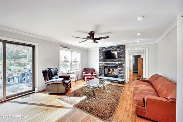 Fireplace, Interior, Living room, Recessed Lighting, Stone Walls, Wood Texture Flooring