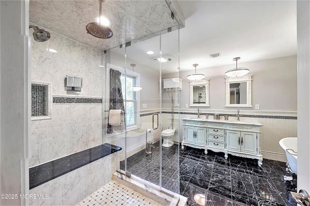 Bathroom, Dual Sink Vanities, Glass Shower, Interior, Marble, Marble Walls, Recessed Lighting