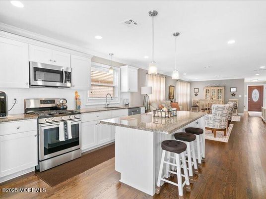 Dining room, Interior, Kitchen, Pendant Lights, Recessed Lighting, Stainless Steel Appliances, Wood Texture Flooring