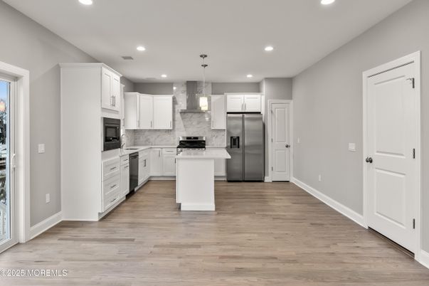 Interior, Kitchen, Marble Walls, Pendant Lights, Recessed Lighting, Stainless Steel Appliances, Wood Texture Flooring