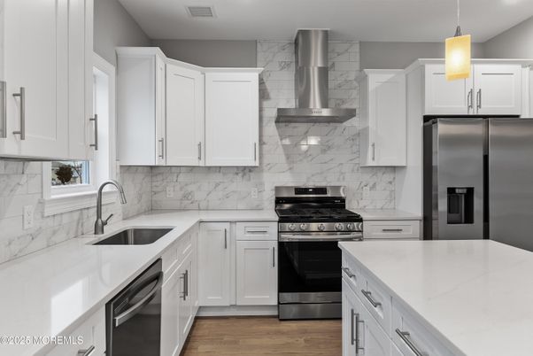 Interior, Kitchen, Marble Walls, Pendant Lights, Recessed Lighting, Stainless Steel Appliances, Wood Texture Flooring
