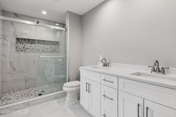 Bathroom, Dual Sink Vanities, Glass Shower, Interior, Marble, Marble Walls, Recessed Lighting