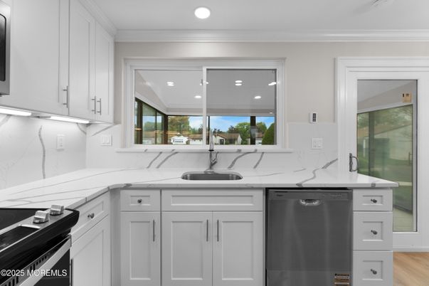 Interior, Kitchen, Marble Walls, Recessed Lighting, Stainless Steel Appliances, Wood Texture Flooring