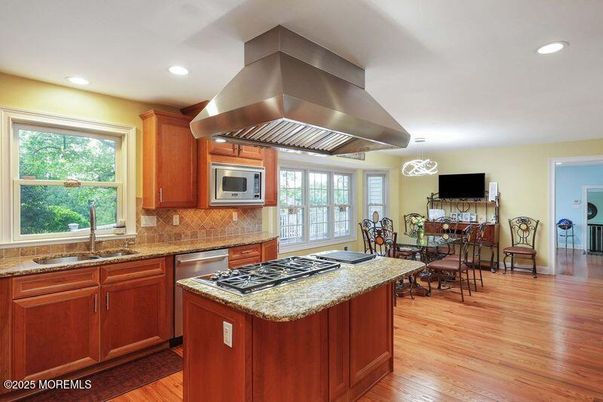 Dining room, Interior, Kitchen, Pendant Lights, Recessed Lighting, Stainless Steel Appliances, Wood Texture Flooring
