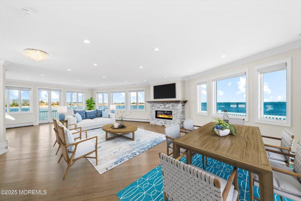 Chandelier, Dining room, Fireplace, Interior, Living room, Recessed Lighting, Water, Wood Texture Flooring