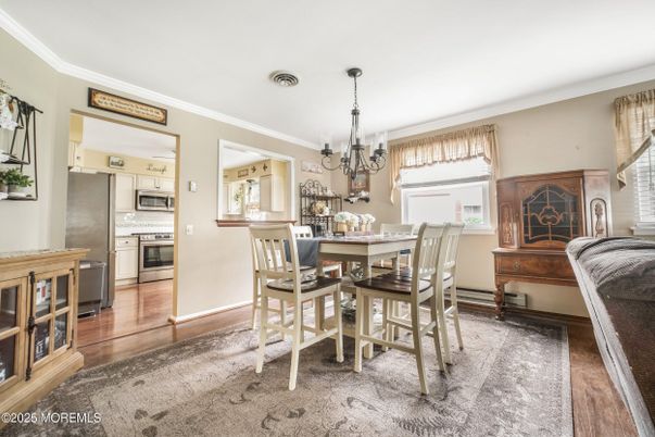 Chandelier, Dining room, Interior, Kitchen, Stainless Steel Appliances, Wood Texture Flooring