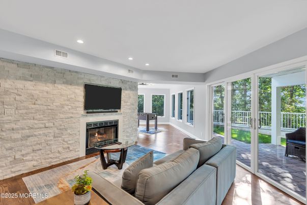 Fireplace, Interior, Living room, Recessed Lighting, Stone Walls, Wood Texture Flooring