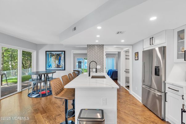 Dining room, Interior, Kitchen, Recessed Lighting, Stainless Steel Appliances, Wood Texture Flooring