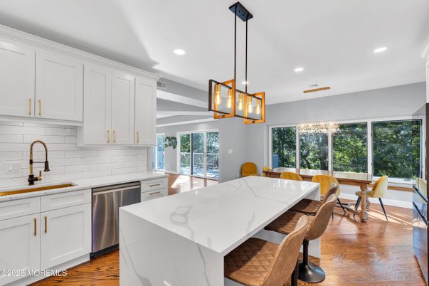 Dining room, Interior, Kitchen, Pendant Lights, Recessed Lighting, Stainless Steel Appliances, Wood Texture Flooring
