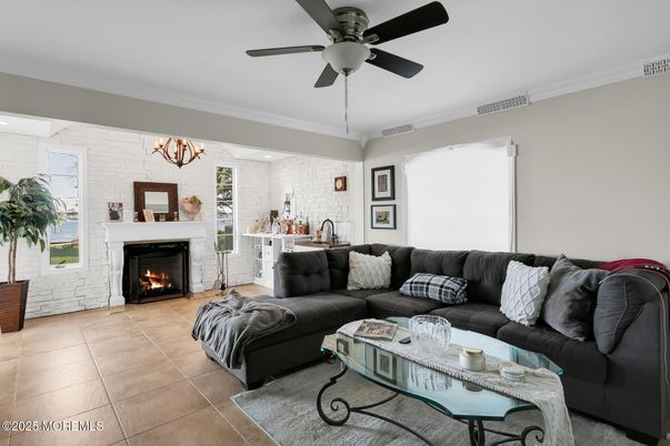Chandelier, Fireplace, Interior, Living room, Stone Walls