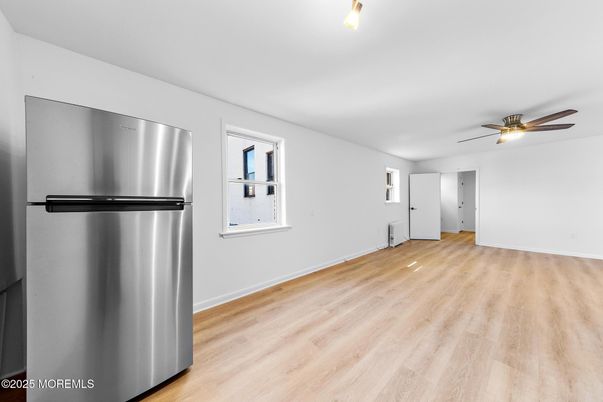 Empty room, Interior, Kitchen, Stainless Steel Appliances, Wood Texture Flooring