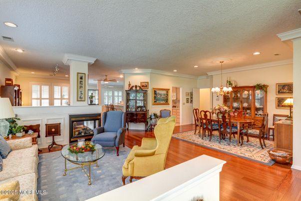 Chandelier, Dining room, Fireplace, Interior, Living room, Recessed Lighting, Wood Texture Flooring