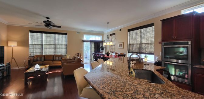 Chandelier, Dining room, Interior, Kitchen, Living room, Pendant Lights, Stainless Steel Appliances, Wood Texture Flooring