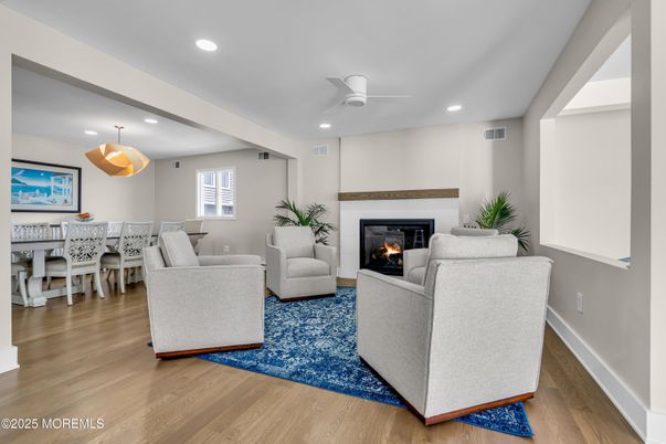 Dining room, Fireplace, Interior, Living room, Pendant Lights, Recessed Lighting, Wood Texture Flooring