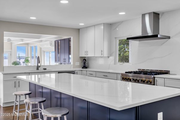 Interior, Kitchen, Marble Walls, Recessed Lighting, Stainless Steel Appliances, Wood Texture Flooring
