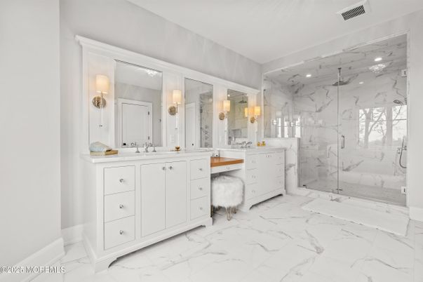 Bathroom, Dual Sink Vanities, Glass Shower, Interior, Marble, Marble Walls, Recessed Lighting