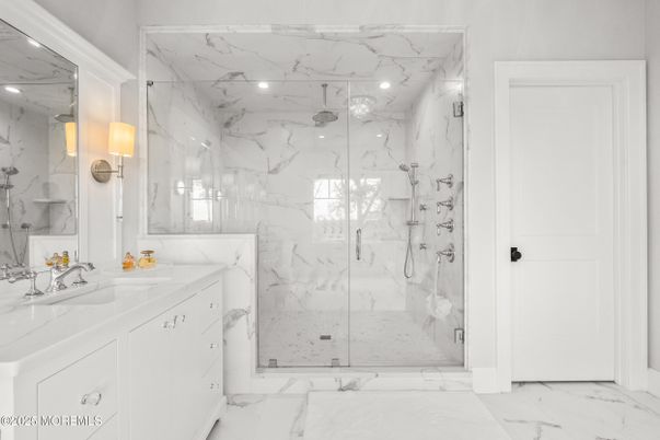 Bathroom, Dual Sink Vanities, Glass Shower, Interior, Marble, Marble Walls, Recessed Lighting