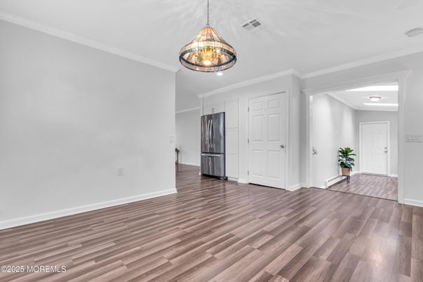 Empty room, Interior, Kitchen, Pendant Lights, Stainless Steel Appliances, Wood Texture Flooring