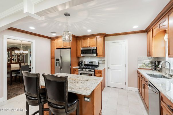 Chandelier, Dining room, Interior, Kitchen, Pendant Lights, Recessed Lighting, Stainless Steel Appliances, Wood Texture Flooring