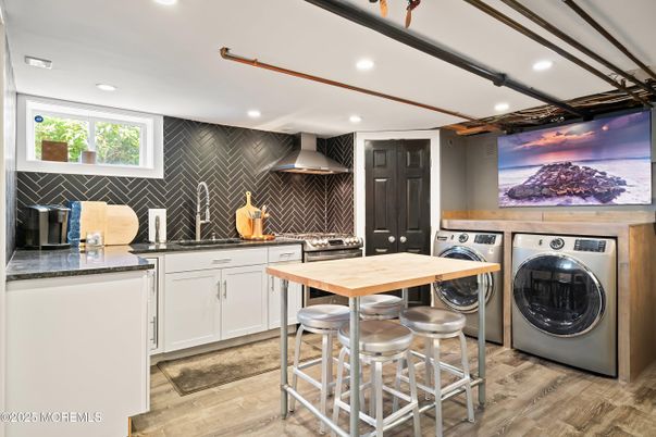 Interior, Kitchen, Recessed Lighting, Washer, Wood Texture Flooring