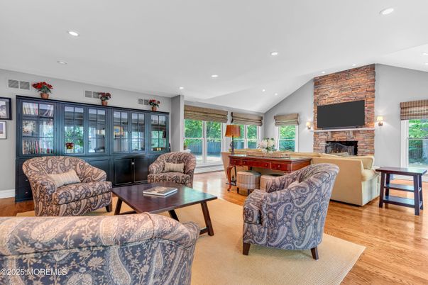 Fireplace, Interior, Living room, Recessed Lighting, Stone Walls, Wood Texture Flooring