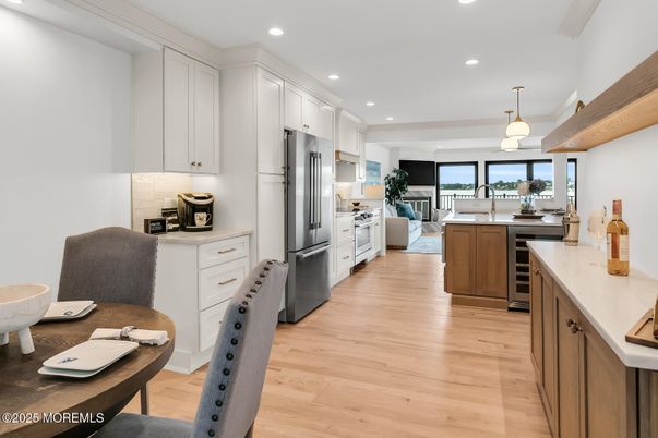 Dining room, Interior, Kitchen, Pendant Lights, Recessed Lighting, Stainless Steel Appliances, Wood Texture Flooring