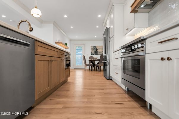 Dining room, Interior, Kitchen, Pendant Lights, Recessed Lighting, Stainless Steel Appliances, Wood Texture Flooring