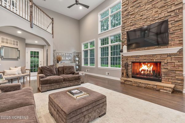 Fireplace, Interior, Living room, Recessed Lighting, Stone Walls, Wood Texture Flooring