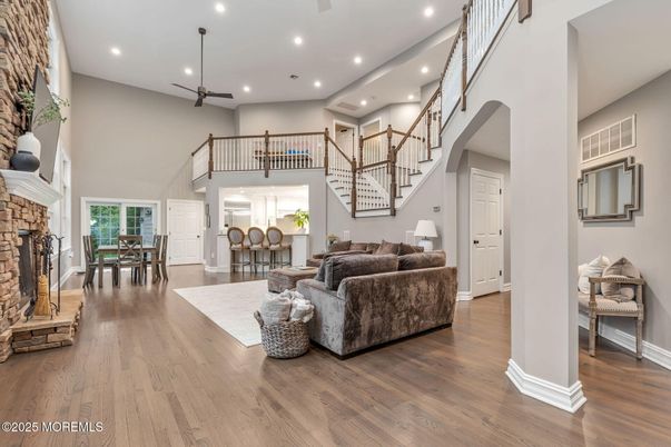 Dining room, Fireplace, Interior, Living room, Recessed Lighting, Wood Texture Flooring