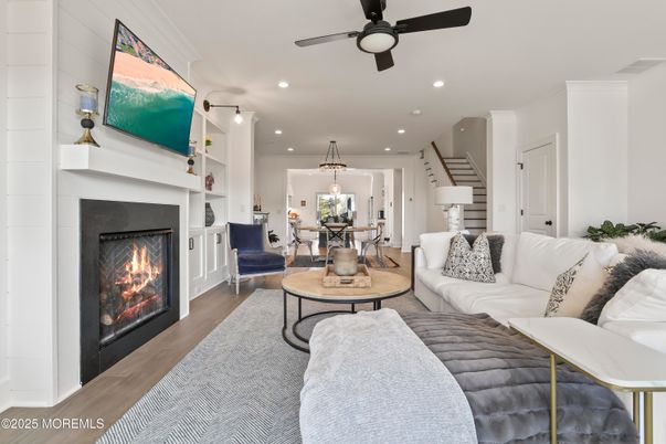 Dining room, Fireplace, Interior, Living room, Pendant Lights, Recessed Lighting, Wood Texture Flooring