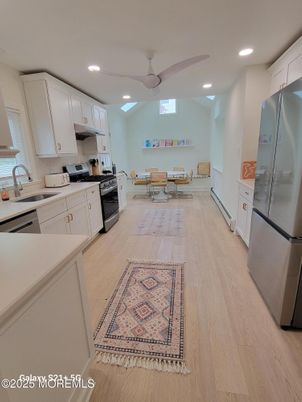 Dining room, Interior, Kitchen, Recessed Lighting, Stainless Steel Appliances, Wood Texture Flooring