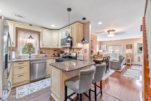 Dining room, Interior, Kitchen, Living room, Pendant Lights, Recessed Lighting, Stainless Steel Appliances, Wood Texture Flooring