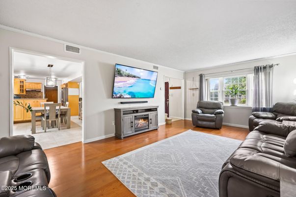 Dining room, Fireplace, Interior, Kitchen, Living room, Pendant Lights, Wood Texture Flooring