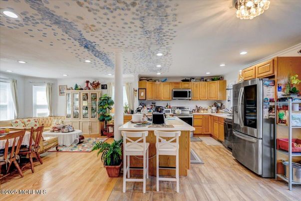 Dining room, Interior, Kitchen, Recessed Lighting, Stainless Steel Appliances, Wood Texture Flooring