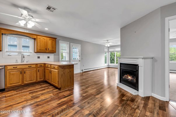 Empty room, Fireplace, Interior, Kitchen, Recessed Lighting, Wood Texture Flooring