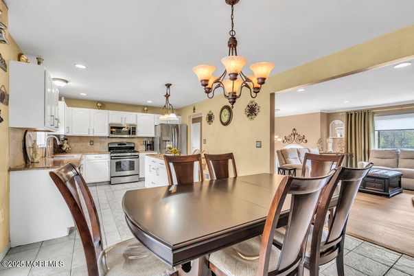 Chandelier, Dining room, Interior, Kitchen, Recessed Lighting, Stainless Steel Appliances, Wood Texture Flooring