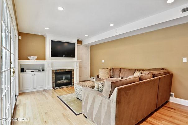 Fireplace, Interior, Living room, Recessed Lighting, Wood Texture Flooring