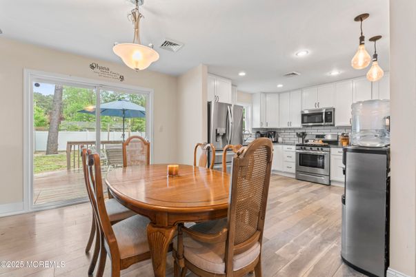 Dining room, Interior, Kitchen, Pendant Lights, Recessed Lighting, Stainless Steel Appliances, Wood Texture Flooring