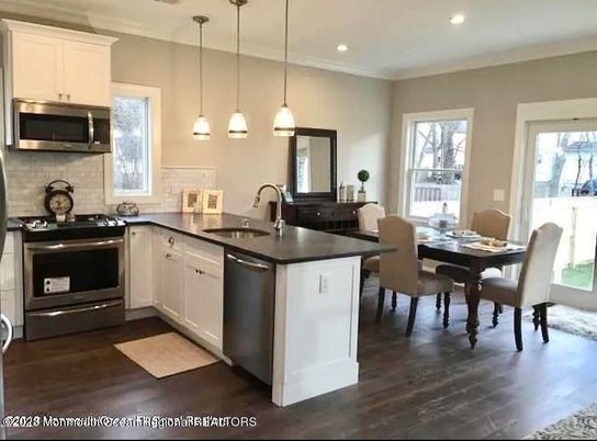 Dining room, Interior, Kitchen, Pendant Lights, Recessed Lighting, Stainless Steel Appliances, Wood Texture Flooring