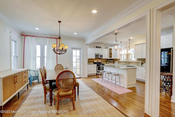 Chandelier, Dining room, Interior, Kitchen, Pendant Lights, Recessed Lighting, Stainless Steel Appliances, Wood Texture Flooring