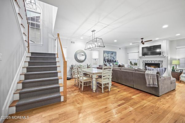 Dining room, Fireplace, Interior, Living room, Pendant Lights, Recessed Lighting, Wood Texture Flooring
