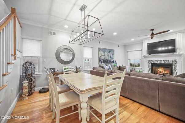 Dining room, Fireplace, Interior, Living room, Pendant Lights, Recessed Lighting, Wood Texture Flooring