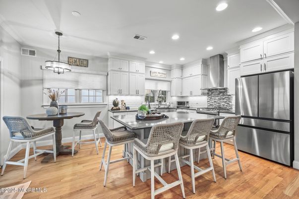 Dining room, Interior, Kitchen, Pendant Lights, Recessed Lighting, Stainless Steel Appliances, Wood Texture Flooring