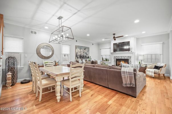 Dining room, Fireplace, Interior, Living room, Pendant Lights, Recessed Lighting, Wood Texture Flooring